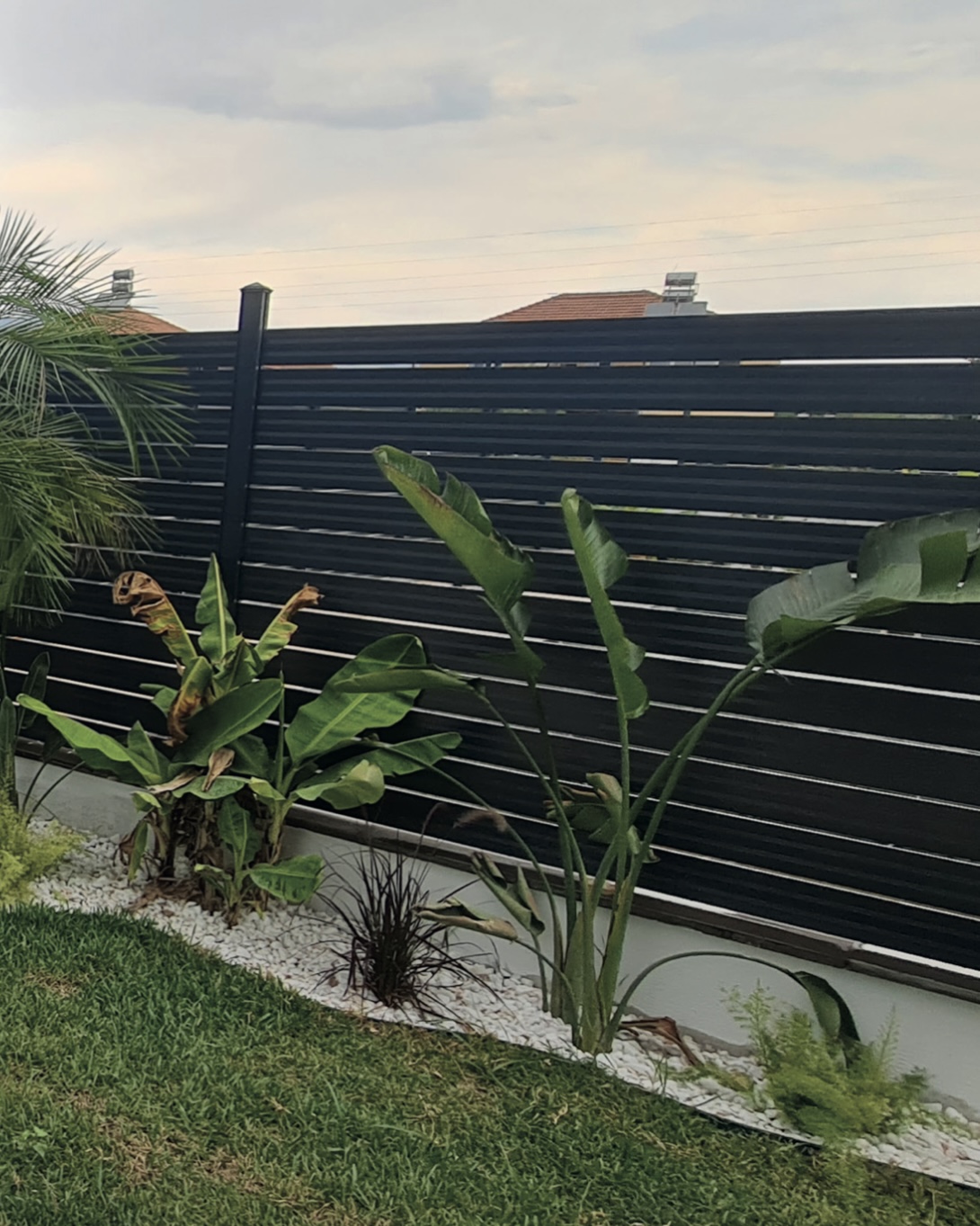 Horizontal slat garden fence