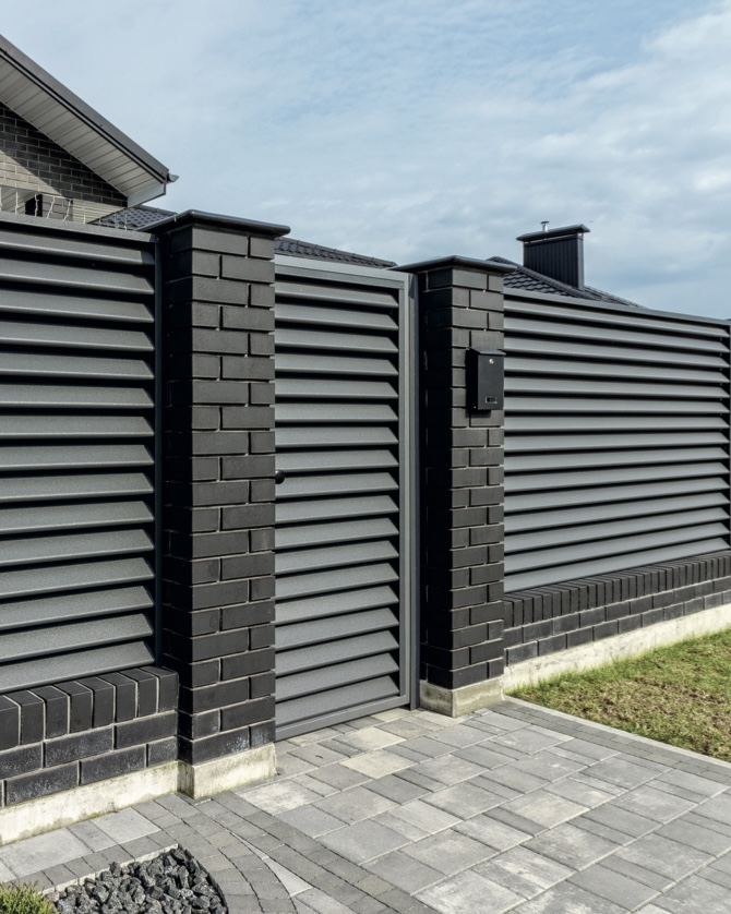 Louvered panels with brick piers